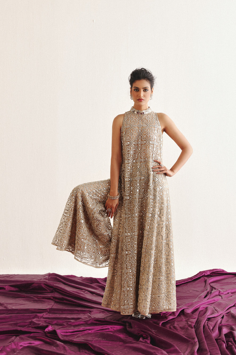 Hi Neck Long Sleeveless Dress With Slits And Flared Shararas