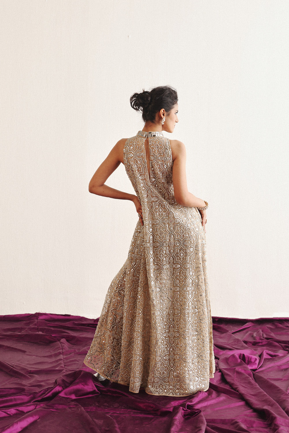 Hi Neck Long Sleeveless Dress With Slits And Flared Shararas