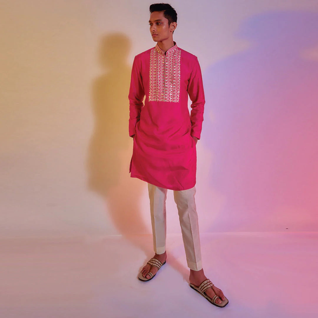 HOT PINK KURTA WITH EMBROIDERED YOKE TEAMED WITH IVORY PLEATED PANTS