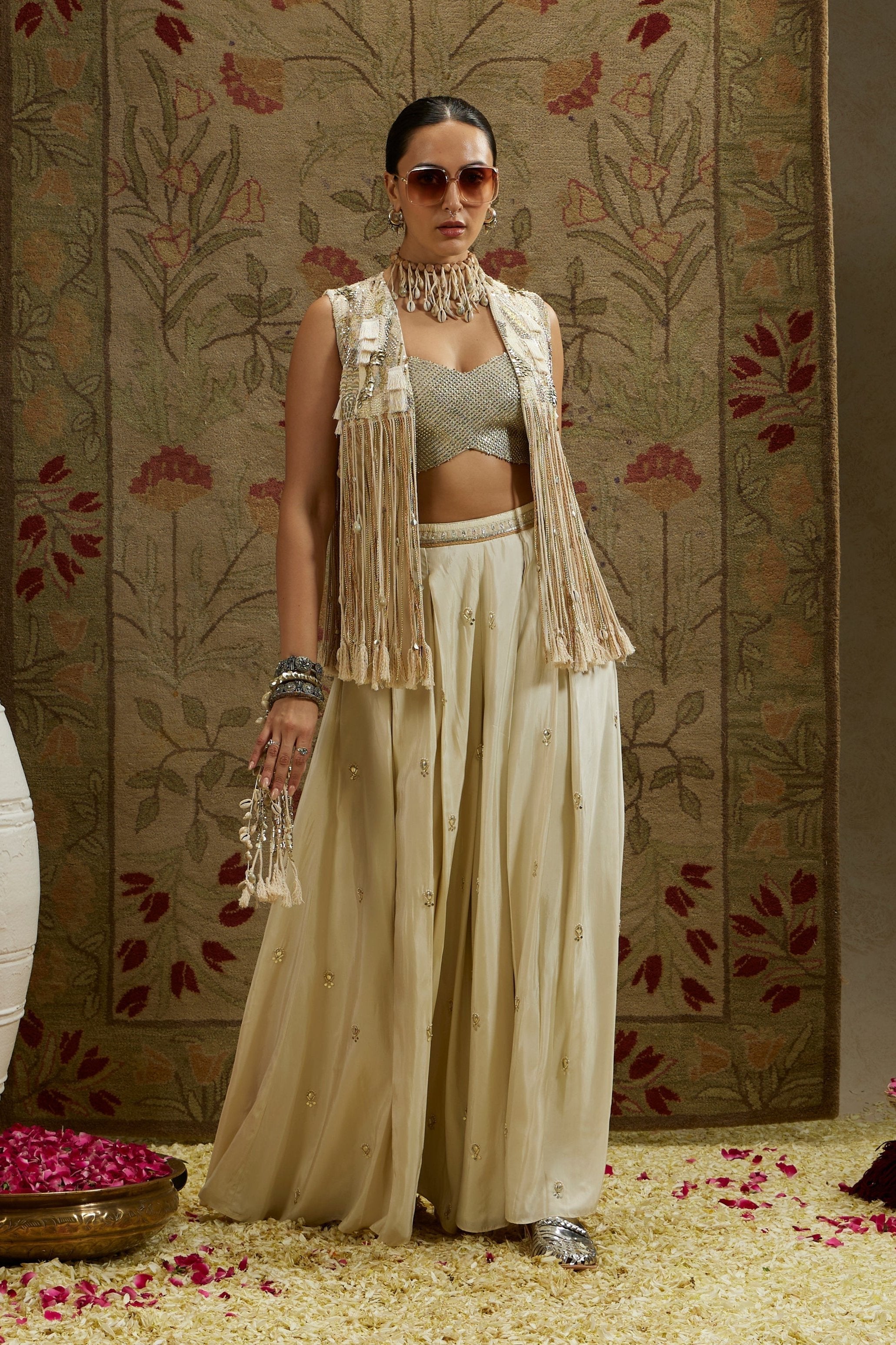 MAGNOLIA THREADWORK FRINGE JACKET PAIRED WTH METALLIC BUSTIER AND EMBELLISED FLARED PANTS