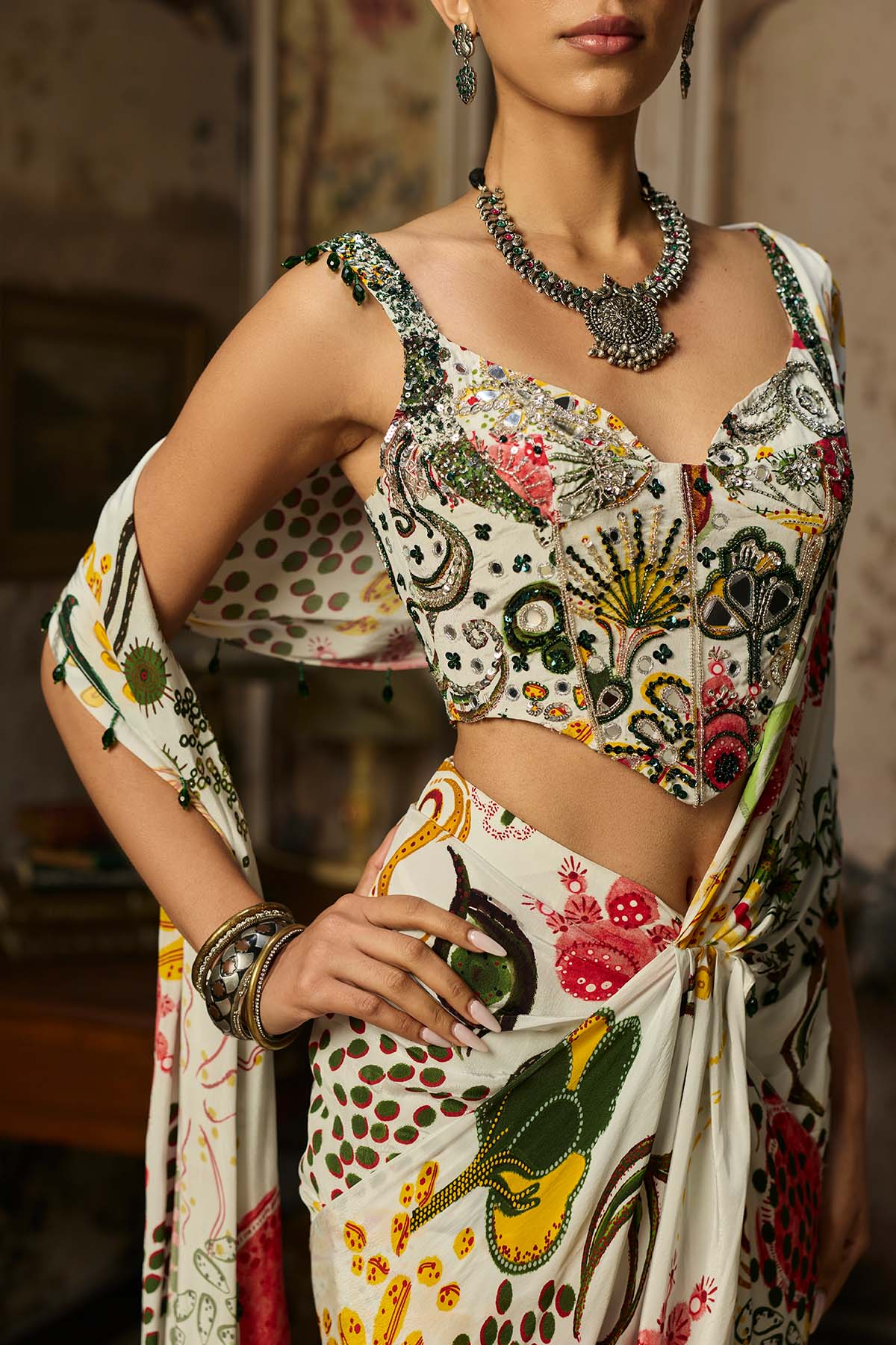 IVORY PRINT AND HIGHLIGHTED CORSET WITH DHOTI SKIRT SAREE SET