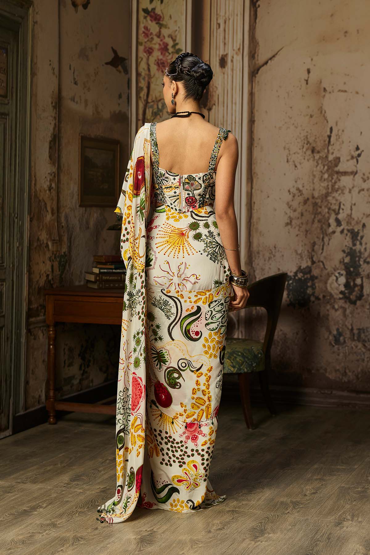 IVORY PRINT AND HIGHLIGHTED CORSET WITH DHOTI SKIRT SAREE SET