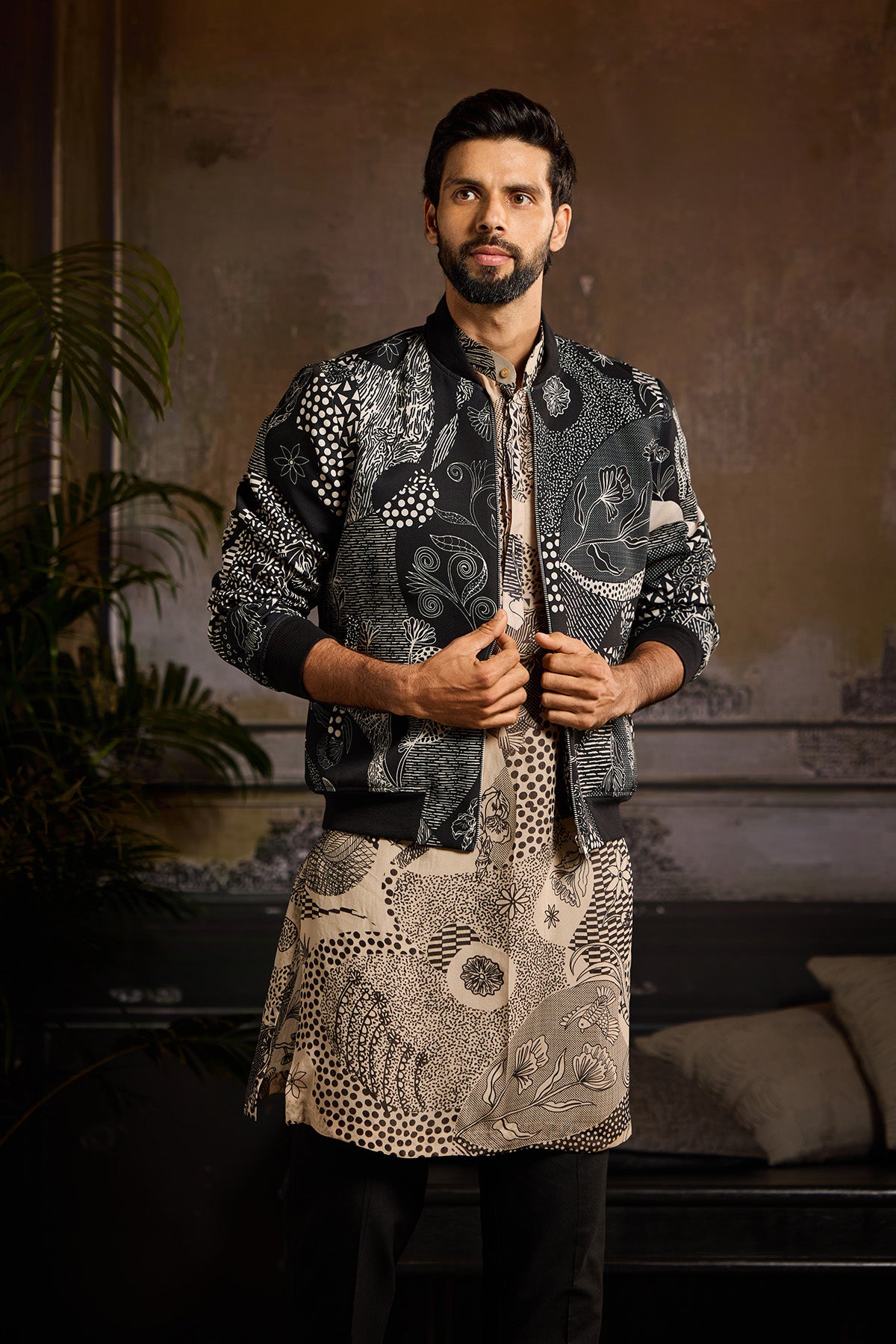BLACK PRINTED BOMBER JACKET WITH BEIGE & BLACK PRINTED KURTA PAIRED WITH BLACK PANTS