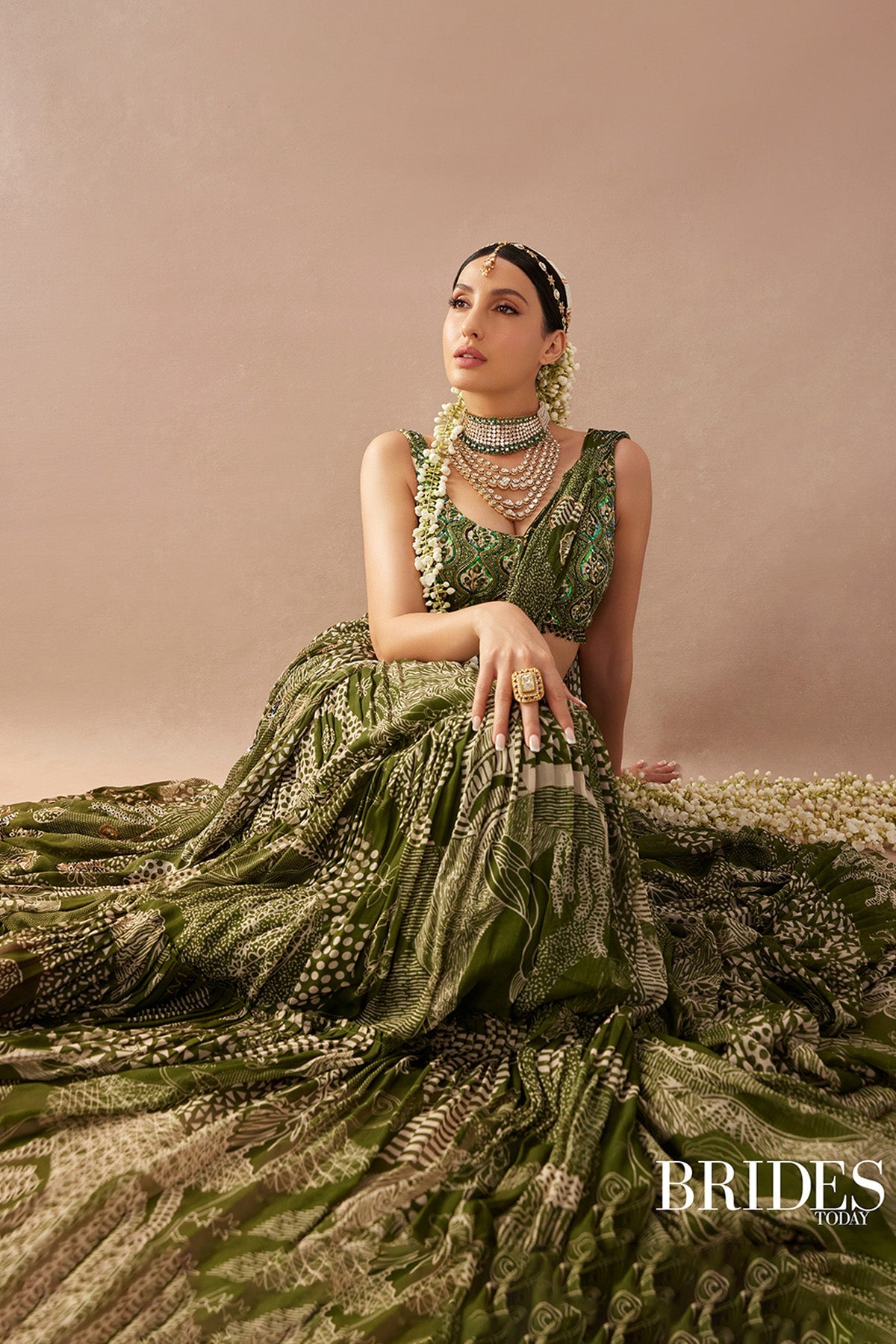 Nora Fatehi in Sage Green Print and Highlighted Skirt Saree Set