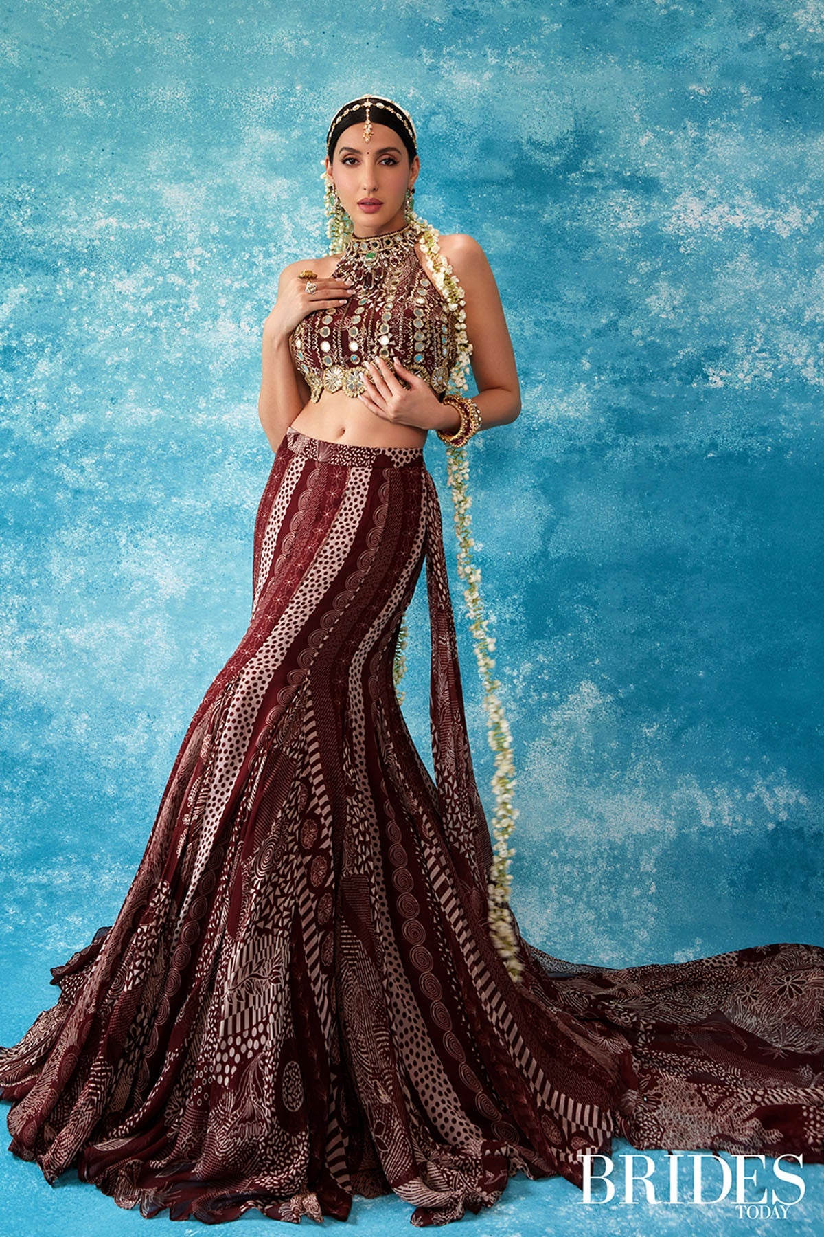 Nora Fatehi in Maroon Print and Highlighted Mermaid Saree Set