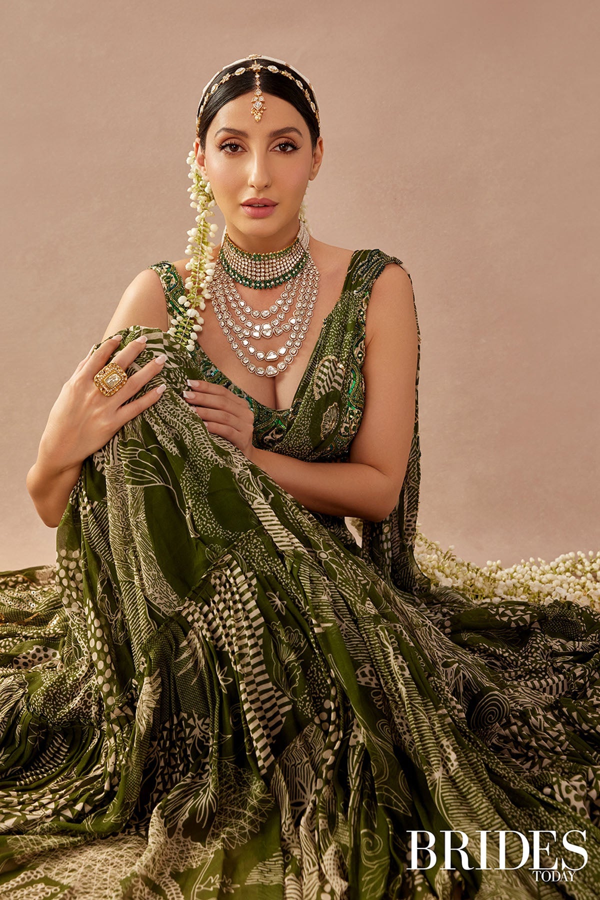 Nora Fatehi in Sage Green Print and Highlighted Skirt Saree Set