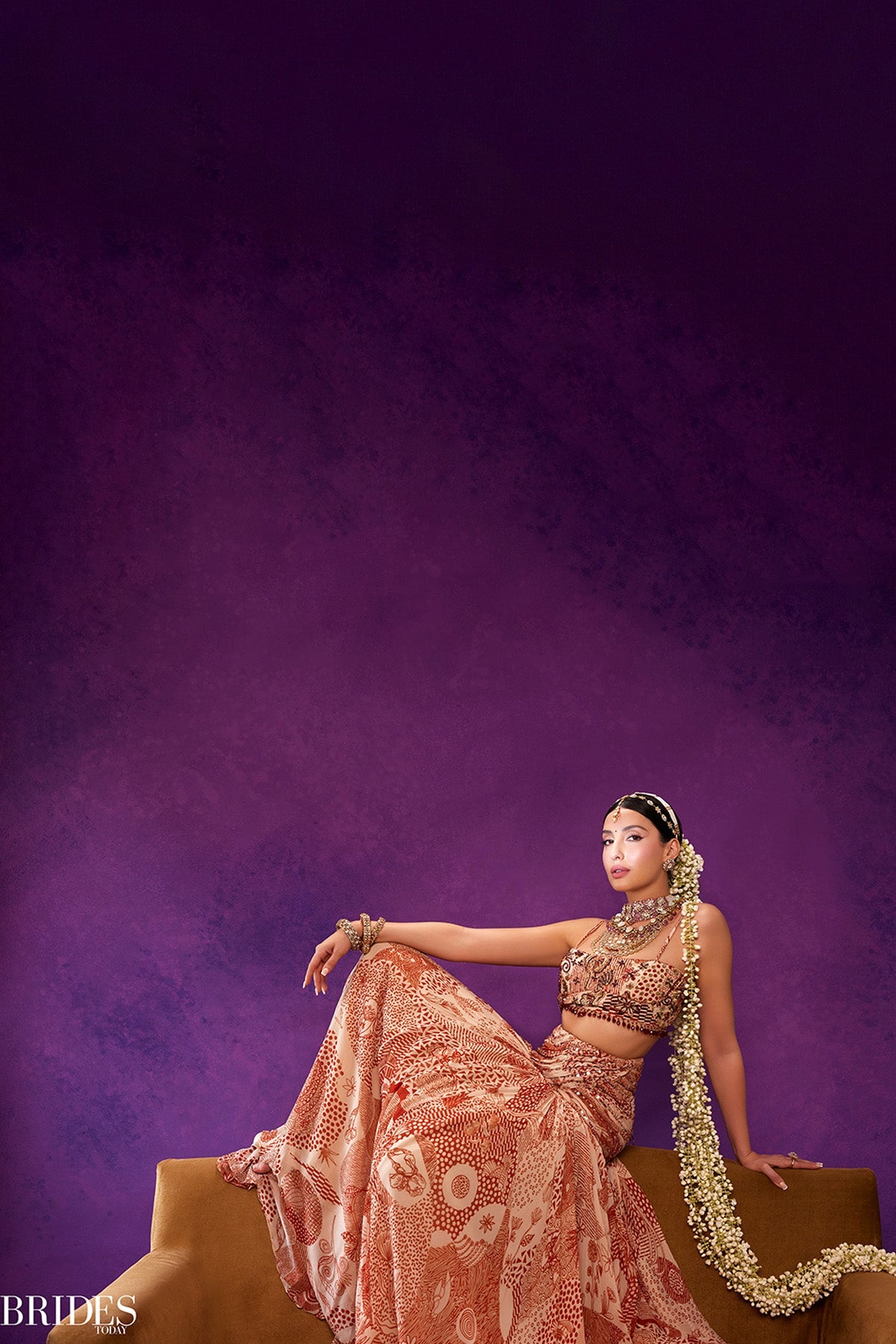 Nora Fatehi in Beige & Rust Print and Highlighted Lehenga Set