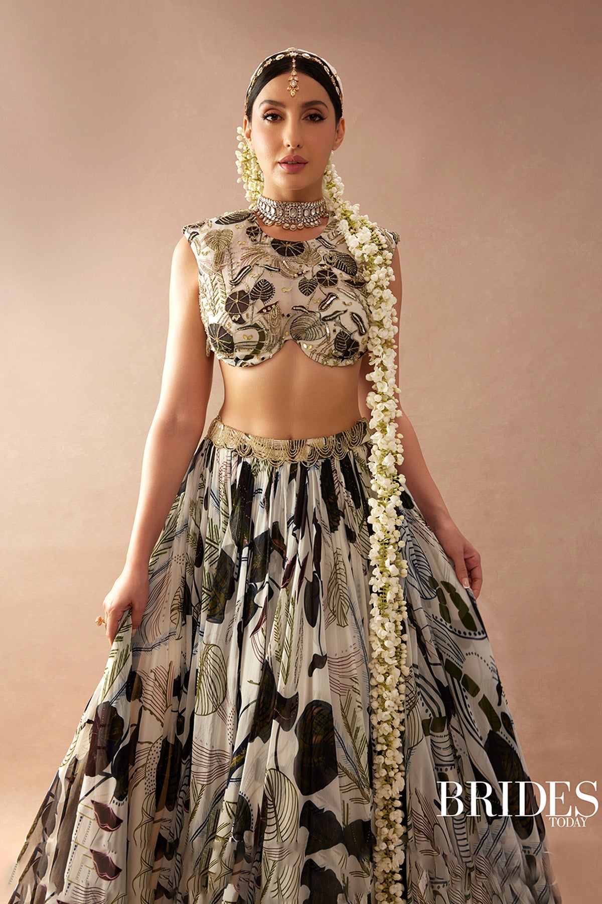 Nora Fatehi in White and Green Print and Highlighted Lehenga Set