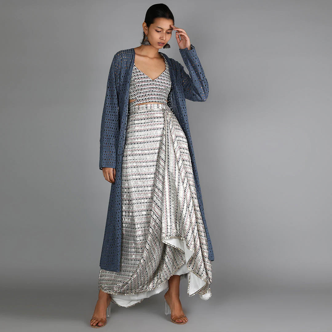 WHITE JAALI PRINT CHANDERI DRAPE SKIRT WITH PRINTED BUSTIER PAIRED WITH DENIM LASER CUT JACKET