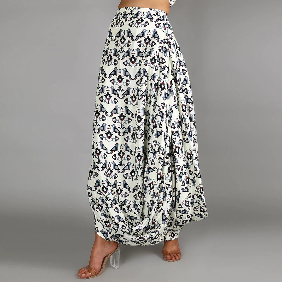 WHITE BIRD PRINT TURTLE NECK CAPE TOP PAIRED WITH WHITE GEOMETRIC DAMASK PRINT DRAPE SKIRT
