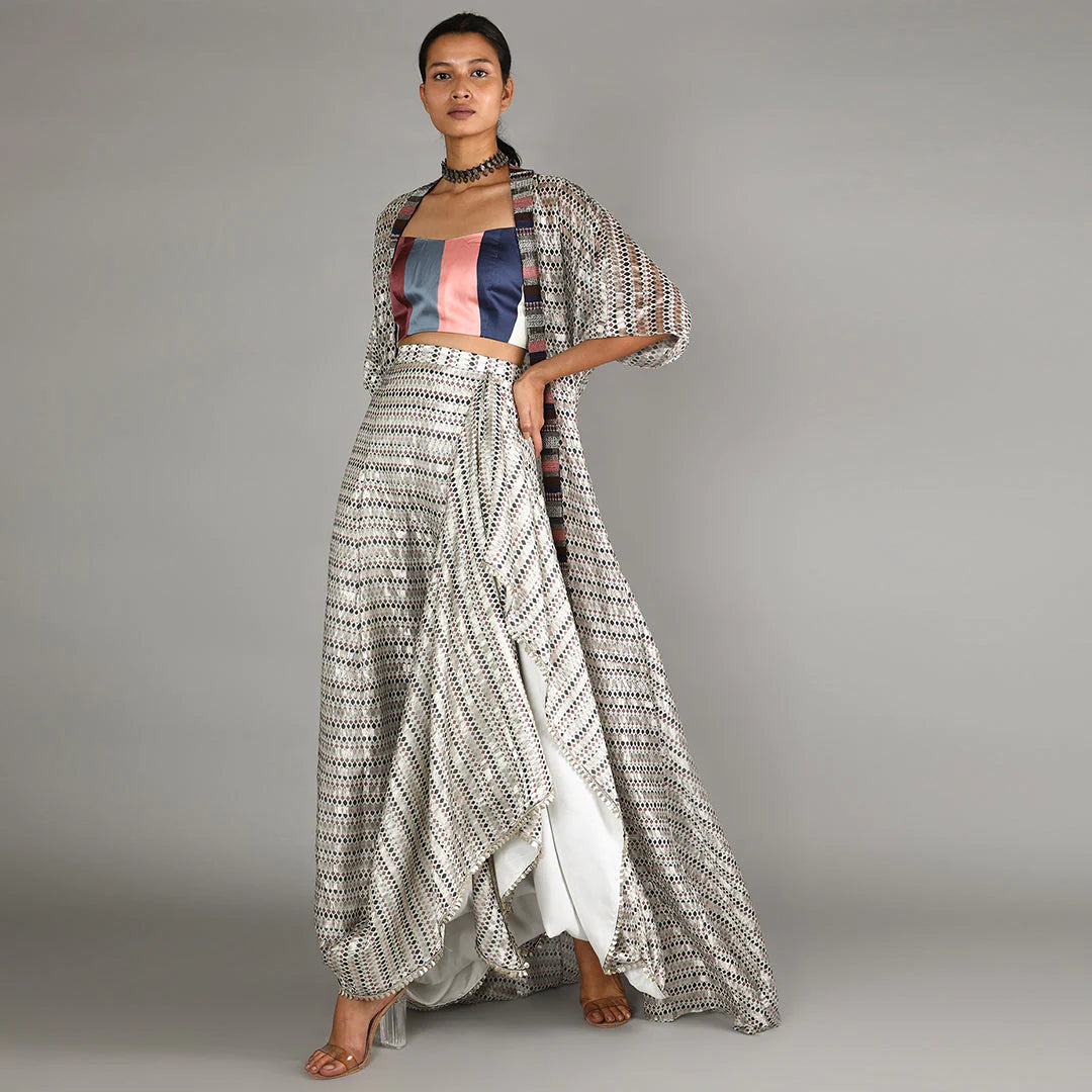 WHITE JAALI PRINT CHANDERI DRAPE SKIRT AND CAPE PAIRED WITH STRIPE PRINT BUSTIER