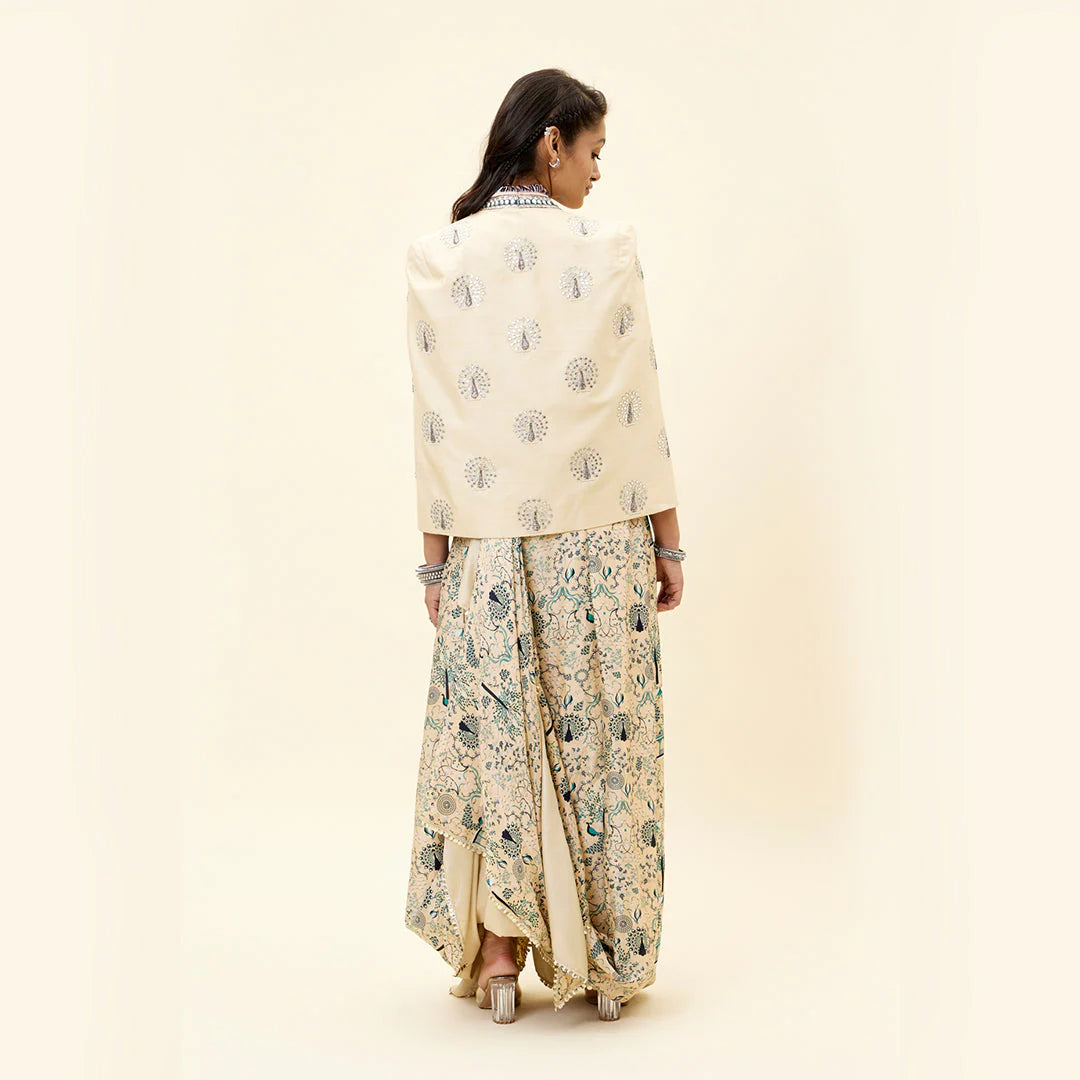 BEIGE MOR JAAL PRINT NUSRAT DRAPED SKIRT AND BUSTIER TEAMED WITH A SIGNATURE STRUCTURED CAPE JACKET