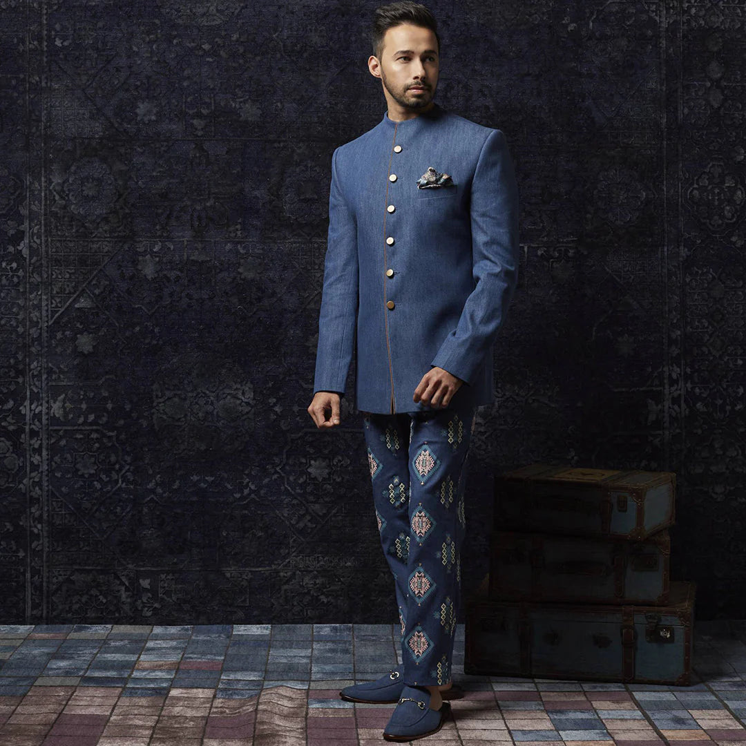 MEDIUM BLUE DENIM BANDHGALA WITH SUED DETAILING PAIRED WITH PRINTED DENIM PANTS
