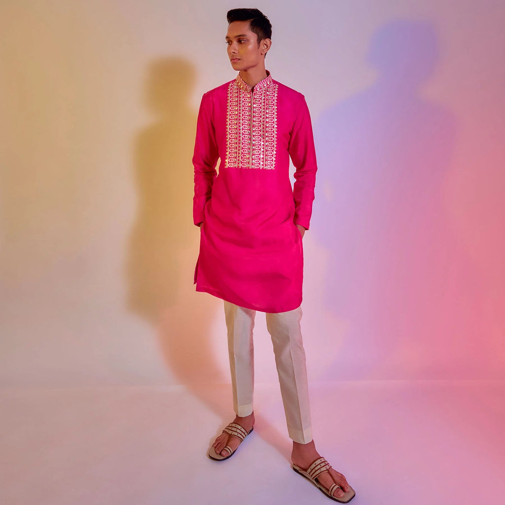 HOT PINK KURTA WITH EMBROIDERED YOKE TEAMED WITH IVORY PLEATED PANTS