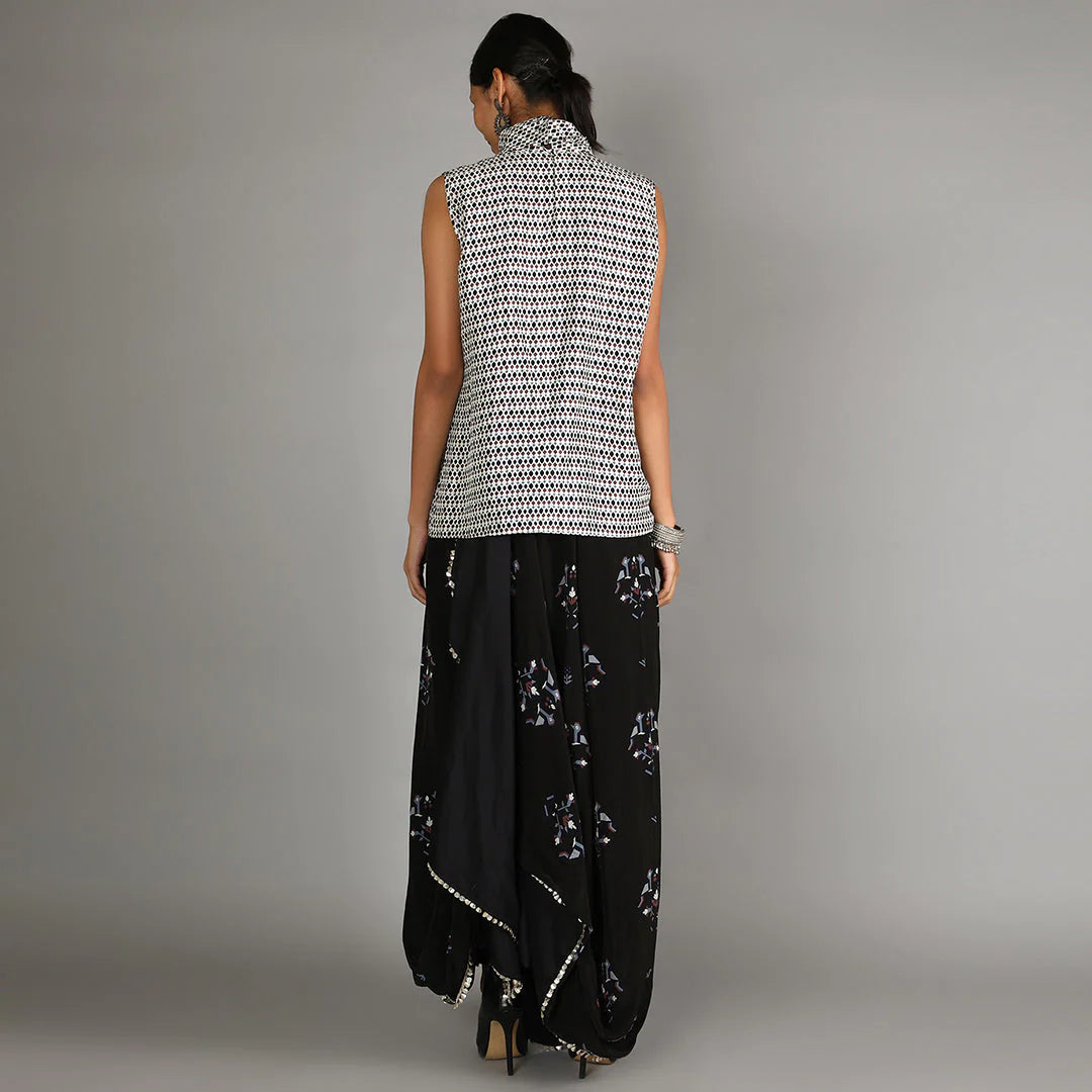JAALI PRINT WHITE TURTLE NECK TOP PAIRED WITH BLACK BIRD PRINT DRAPE SKIRT WITH CAPE