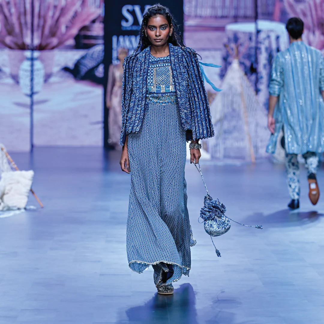 BLUE GEOMETRIC PRINT JUMPSUIT WITH BLUE TEXTURED NOOR JACKET