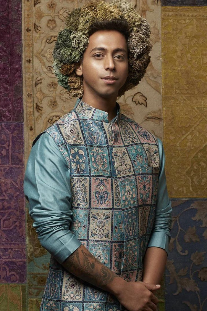 TEAL BLUE SILK KURTA WITH EMBROIDERY DETAILING ON COLLAR PAIRED WITH PATCHWORK PRINT BUNDI