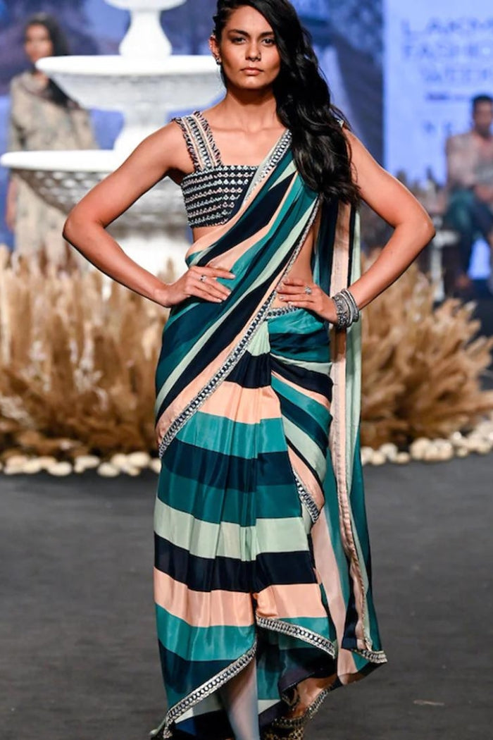 STRIPE PRINT PRE STITCHED CASCASE SAREE TEAMED WITH AN EMBELLISHED BANDEAU BLOUSE