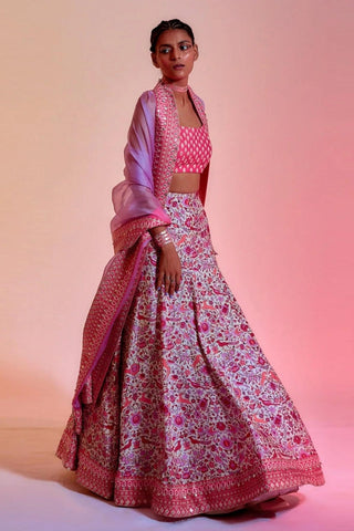 PINK MOR JAAL PRINT BIKINI BUSTIER TEAMED WITH BOX PLEATED PANTS AND A PATCHWORK NOOR CAPE JACKET
