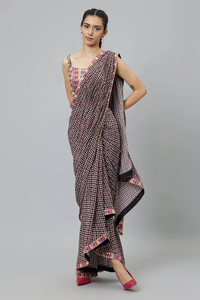 BLACK GEOMETRIC PRINT CASCASE SAREE TEAMED WITH EMBELLISHED BUSTIER