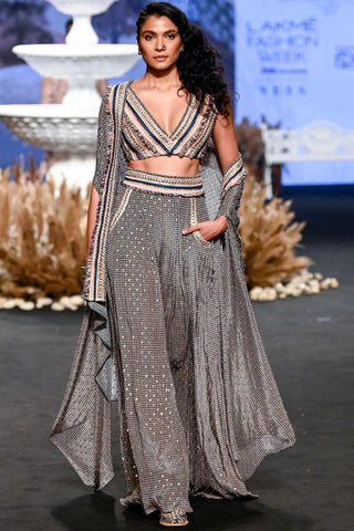 STRIPE PRINTED LUCKNOWI LEHNGA TEAMED WITH A PATCHWORK CORSET AND STRUCTURED CAPE JACKET