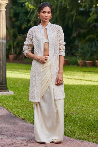 WHITE JAALI PRINT CHANDERI DRAPE SKIRT AND CAPE PAIRED WITH STRIPE PRINT BUSTIER