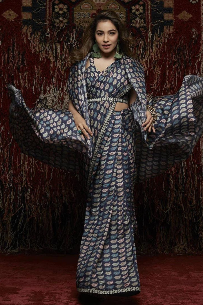KAIRI PRINT SAREE PAIRED WITH PRINTED TIE UP BUSTIER AND PRINTED CAPE AND EMBROIDERED BELT