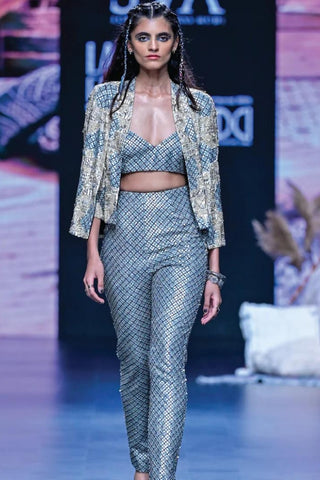 BEIGE MOR JAAL PRINT NUSRAT DRAPED SKIRT AND BUSTIER TEAMED WITH A SIGNATURE STRUCTURED CAPE JACKET