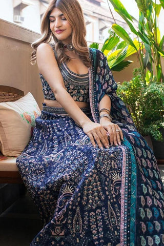 BLUE RUSSIAN SHARARA WITH EMBROIDERY BUSTIER AND BLUE LEAF PRINT HIGHLIGHTED CAPE