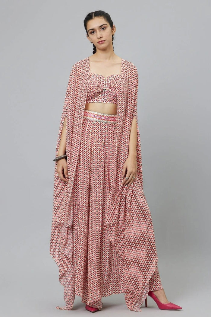 IVORY GEOMETRIC PRINT BIKINI BUSTIER WITH BOX PLEATED PANTS AND CAPE