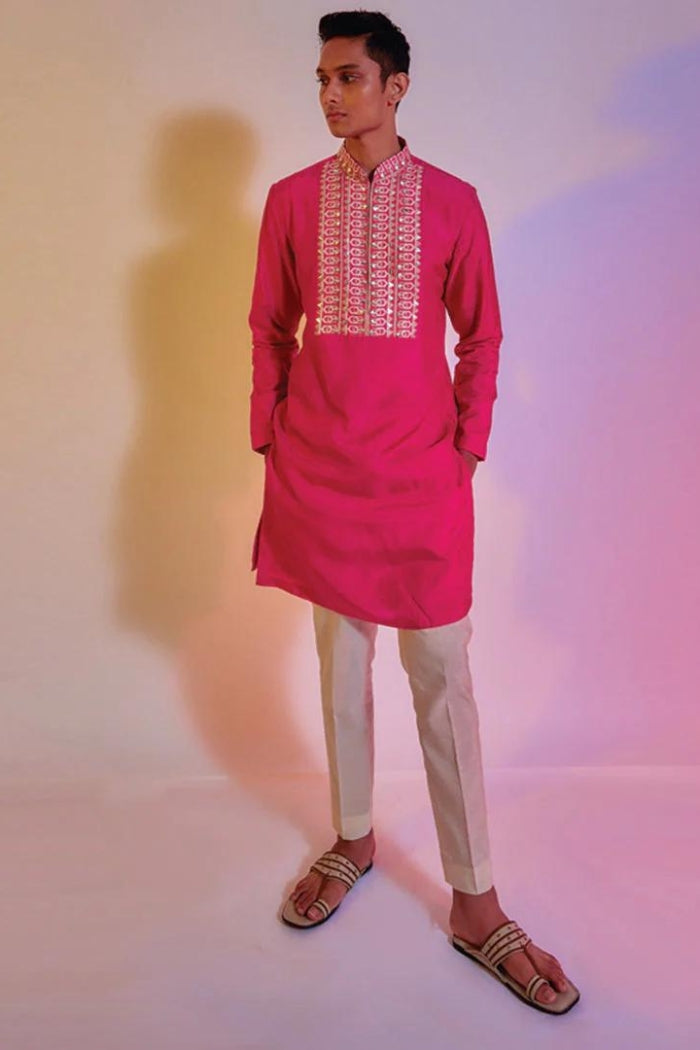 HOT PINK KURTA WITH EMBROIDERED YOKE TEAMED WITH IVORY PLEATED PANTS