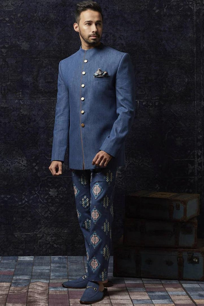 MEDIUM BLUE DENIM BANDHGALA WITH SUED DETAILING PAIRED WITH PRINTED DENIM PANTS