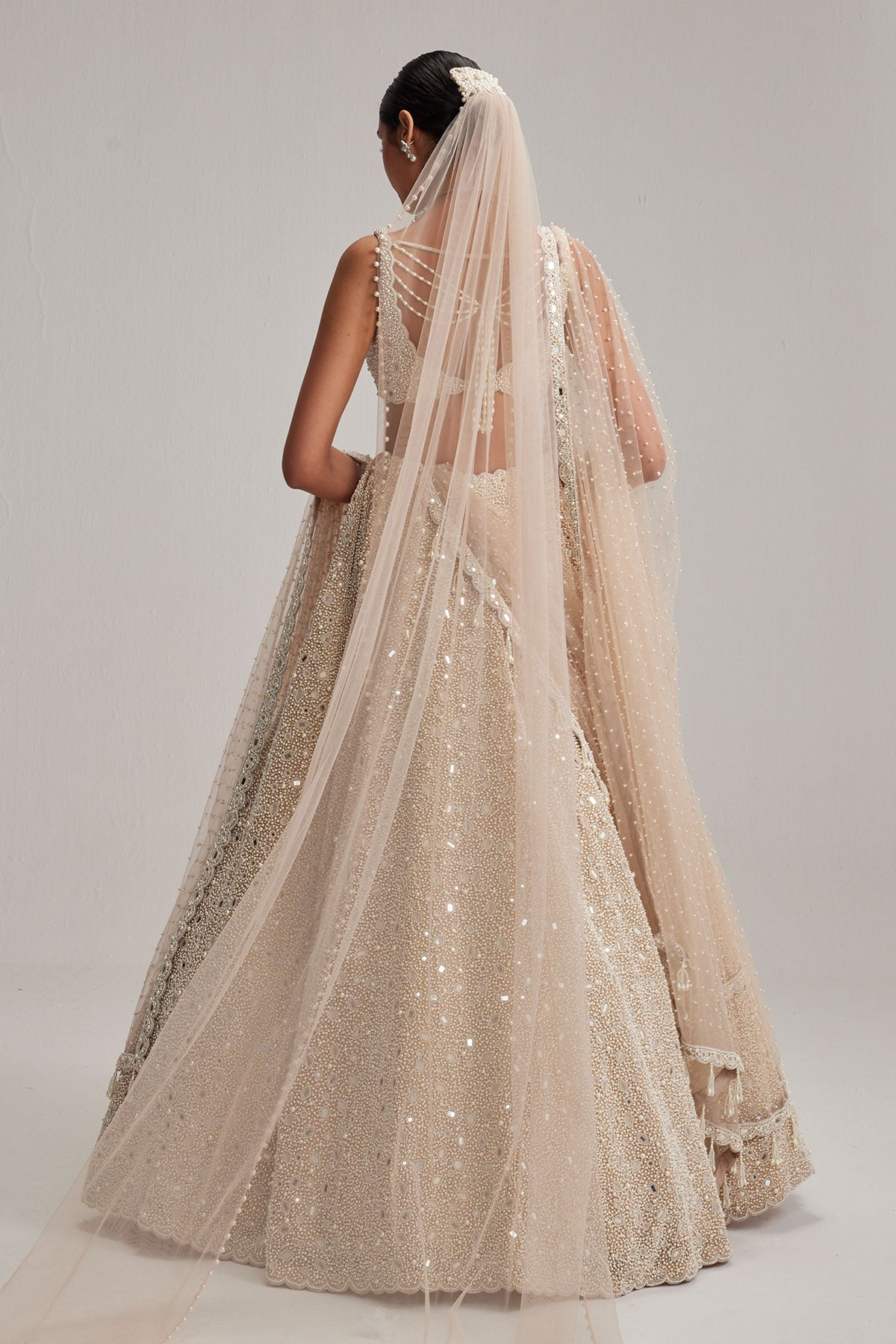 Light Beige Dense mirror and pearl lehenga set with Double Dupatta and Veil