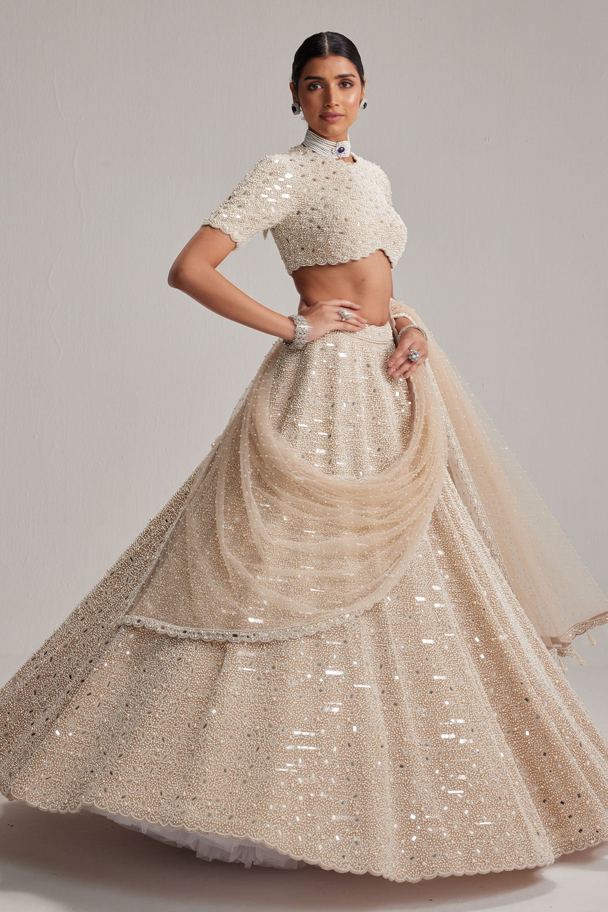 Light Beige Dense mirror and pearl lehenga set with High neck Blouse and Dupatta