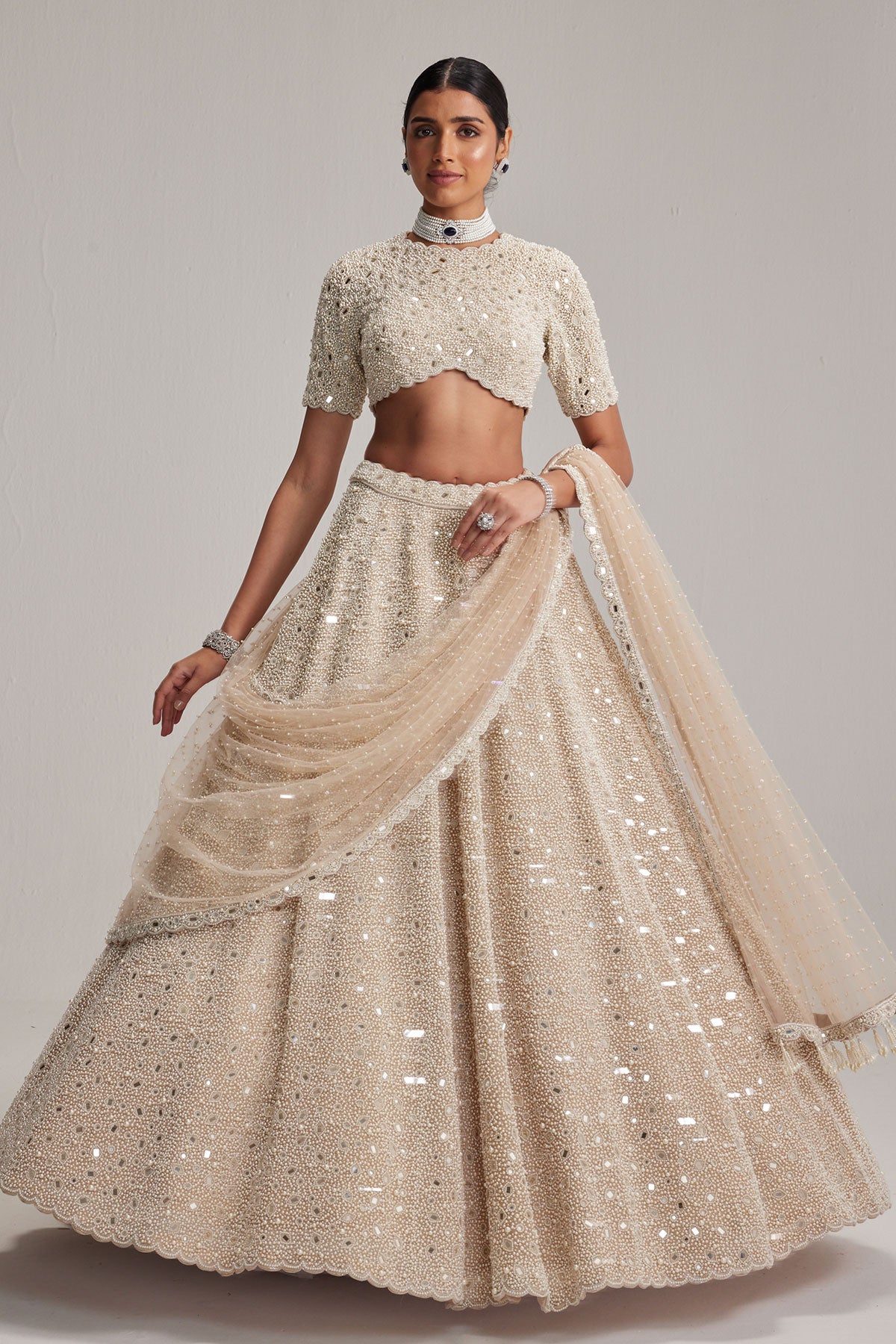 Light Beige Dense mirror and pearl lehenga set with High neck Blouse and Dupatta