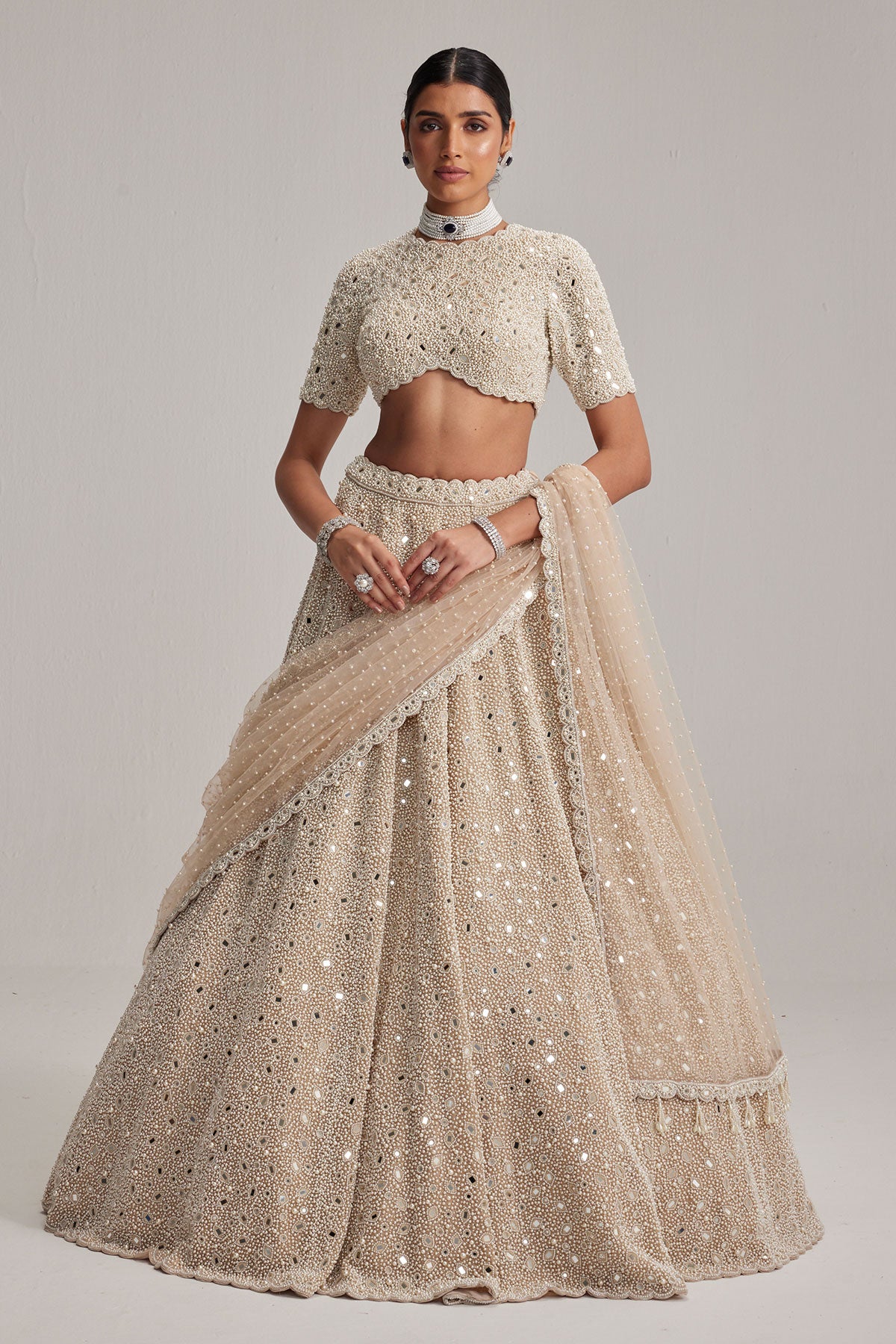 Light Beige Dense mirror and pearl lehenga set with High neck Blouse and Dupatta