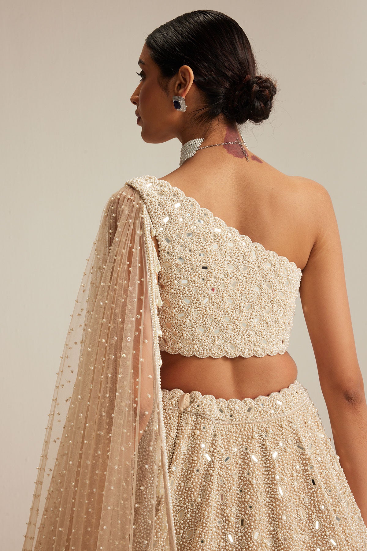Light Beige Dense mirror and pearl one shoulder lehenga set