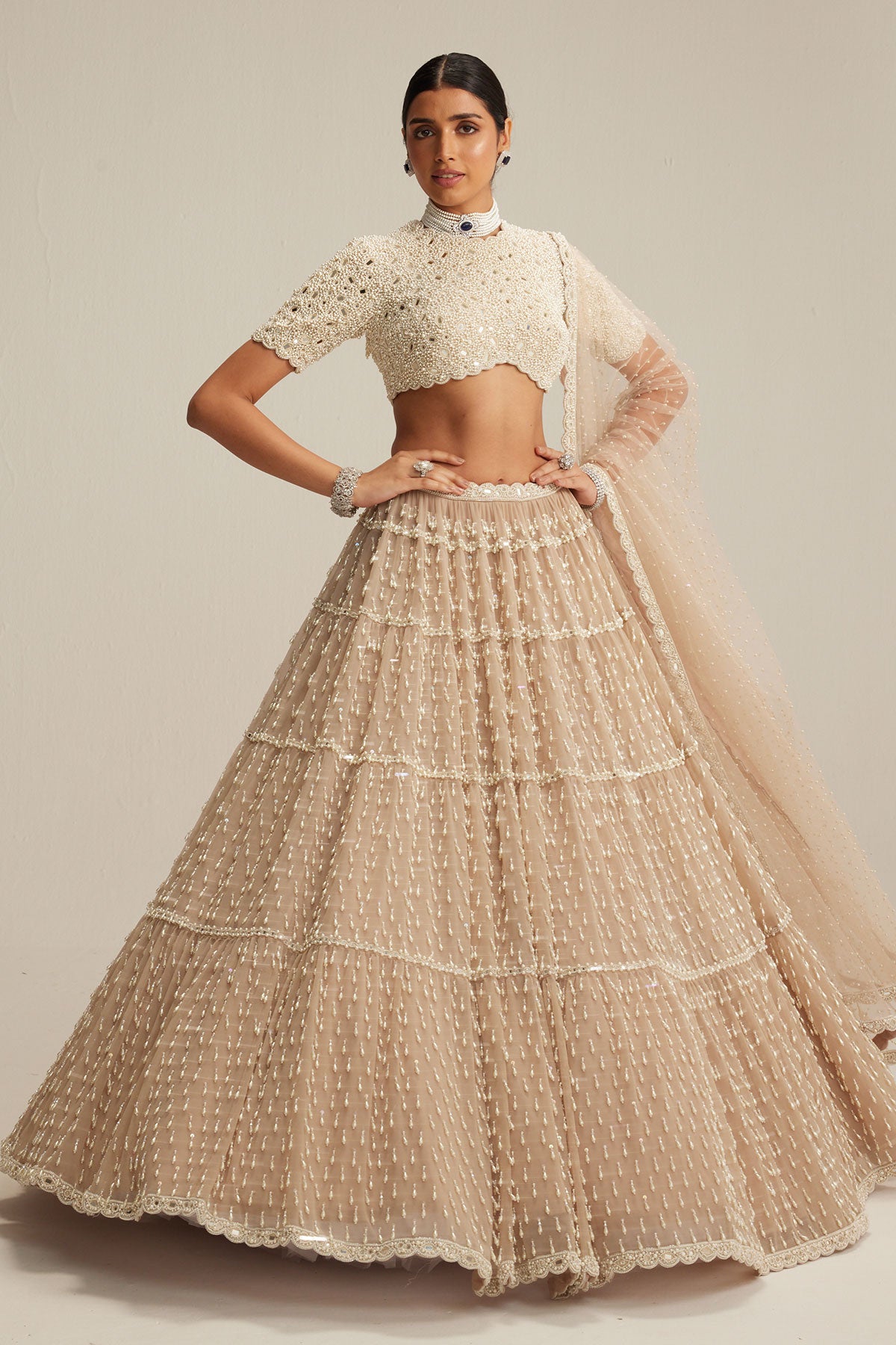 Light Beige Pearl Drop Multi Tier Lehenga With High Neck Blouse Set.
