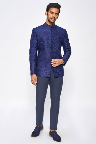 MEDIUM BLUE DENIM BANDHGALA WITH SUED DETAILING PAIRED WITH PRINTED DENIM PANTS