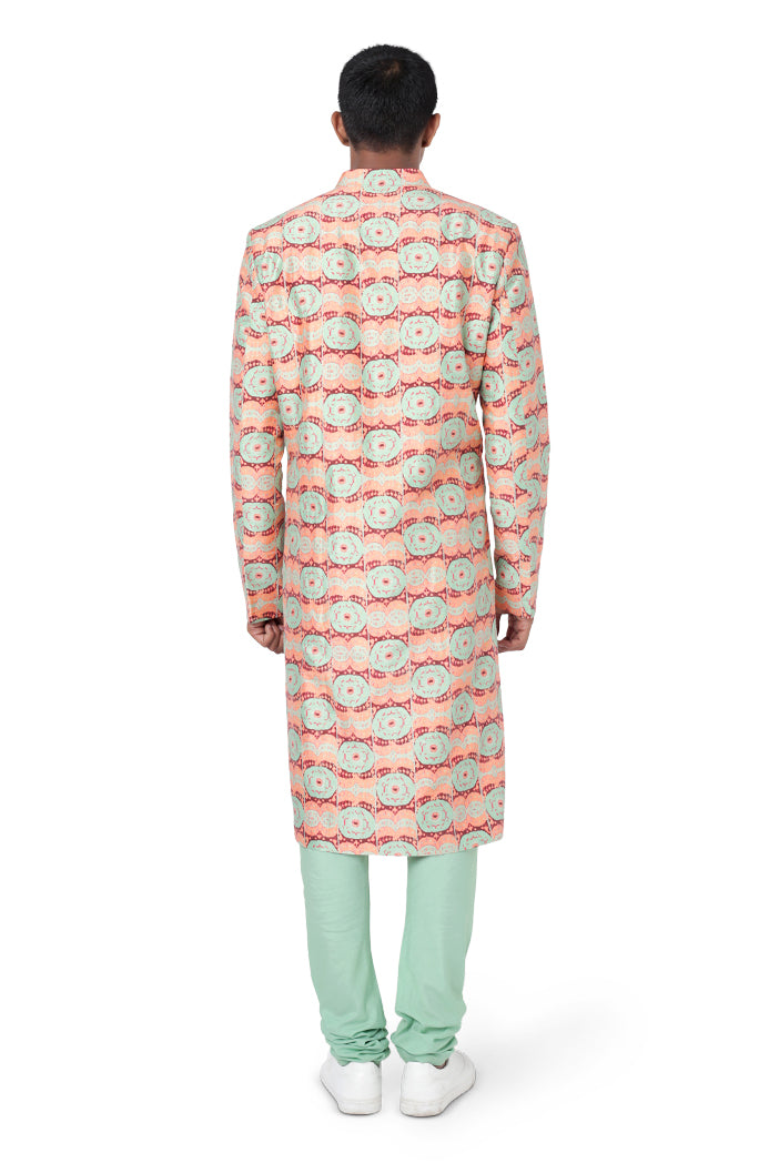 CORAL COLOUR PRINTED DUPION SILK SHERWANI AND MINT COLOUR COTTON SILK CHURIDAR