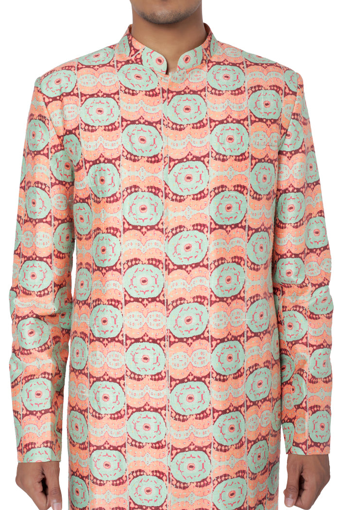 CORAL COLOUR PRINTED DUPION SILK SHERWANI AND MINT COLOUR COTTON SILK CHURIDAR