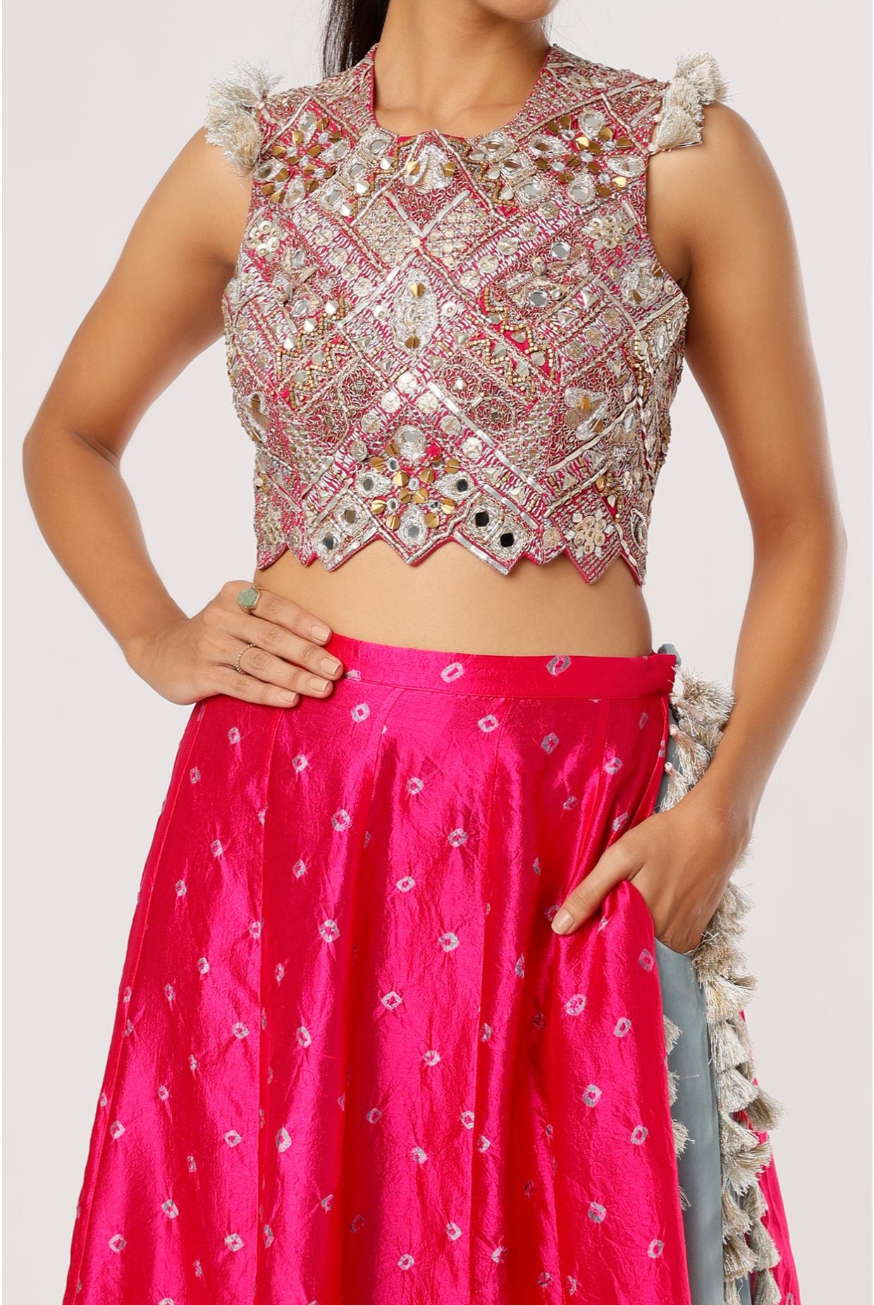 HOT PINK GEORGETTE EMBROIDERED CHOLI AND PERIWINKLE BLUE CREPE LOW CROTCH PANT WITH ATTACHED PINK BANDHANI SILK SKIRT