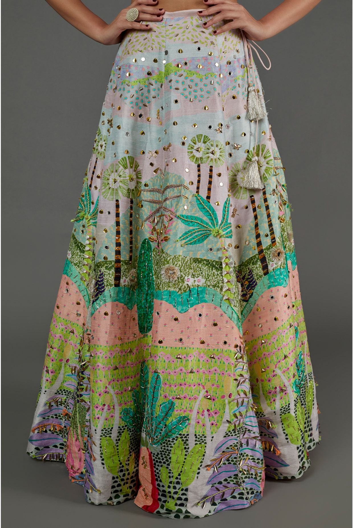 PINK KITE PRINT GEORGETTE EMBROIDERED BUSTIER AND TROPICAL PRINT DUPION SILK EMBROIDERED LEHENGA WITH PINK MUKAISH NET DUPATTA