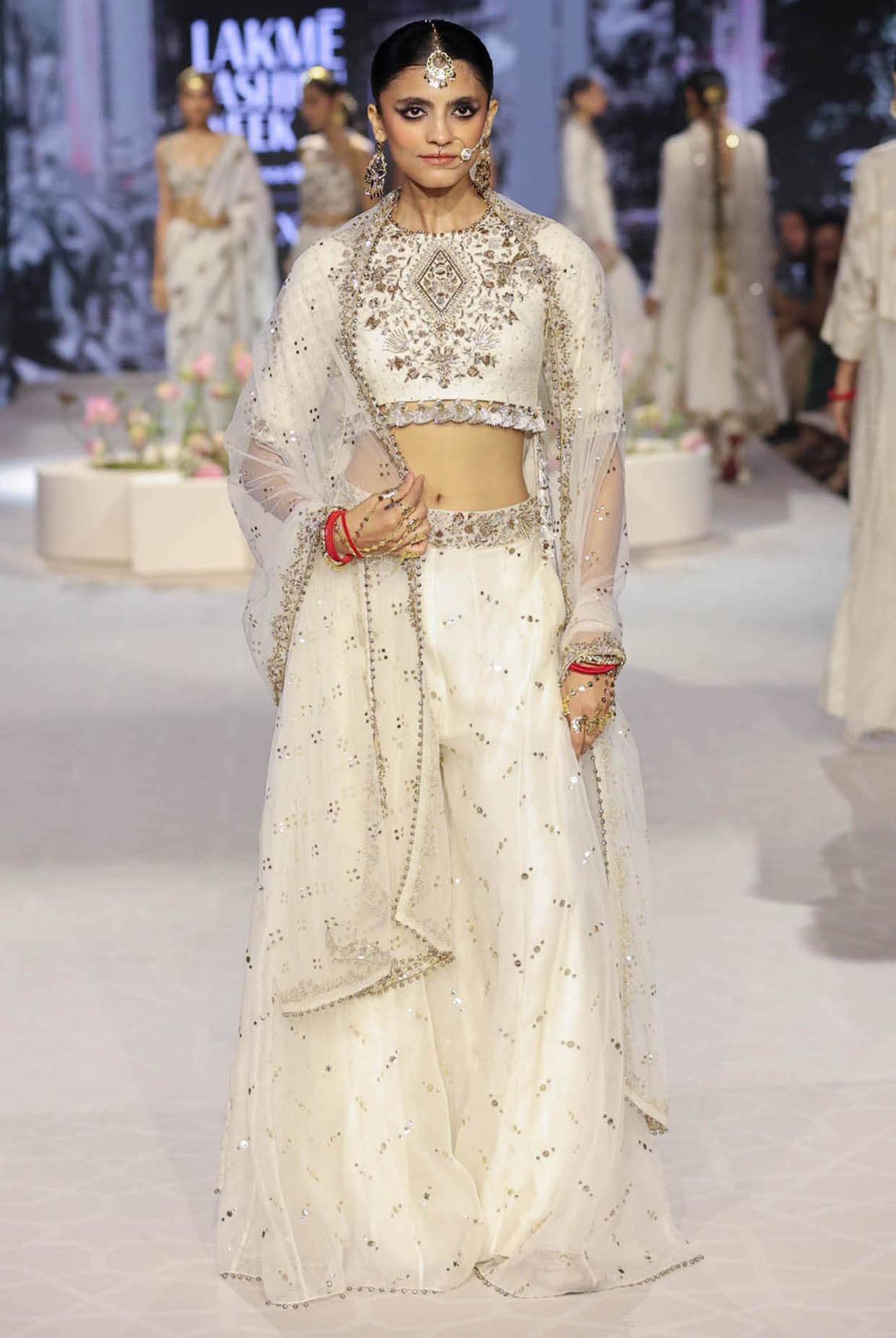 Shakira Off White Embroidered High Low Choli With Sharara And Dupatta