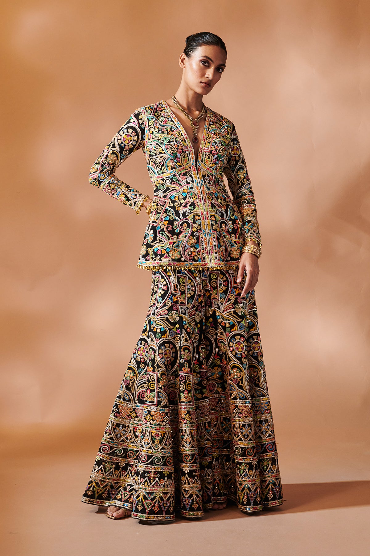 BLACK SHARARA WITH A PEPLUM KURTA