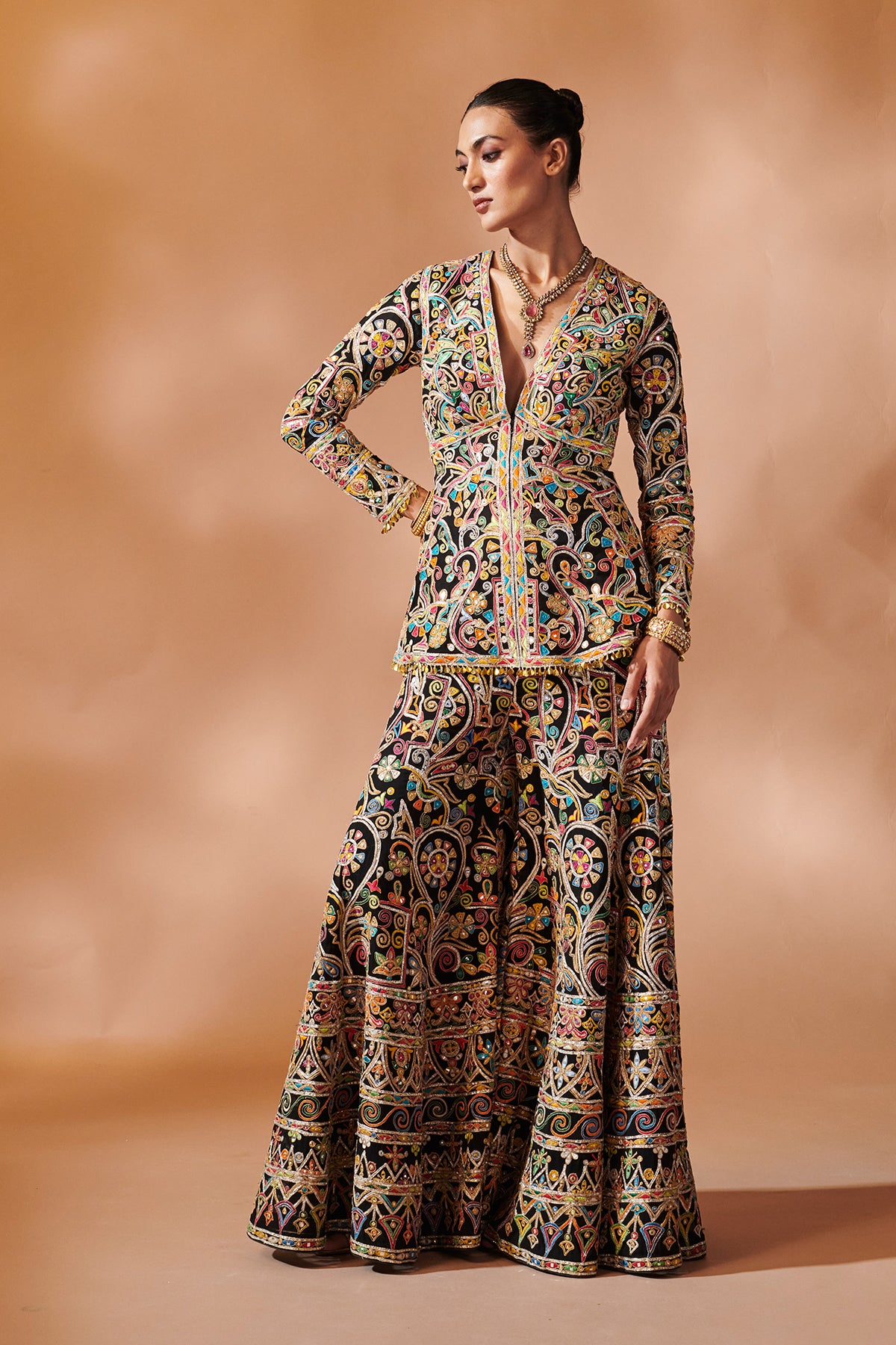 BLACK SHARARA WITH A PEPLUM KURTA