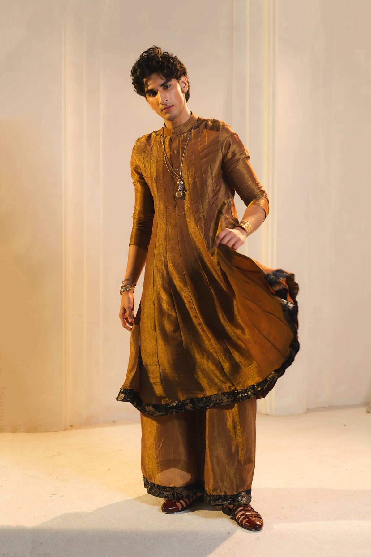 Anarkali Kurta In Gold, Paired With Flared Trousers.