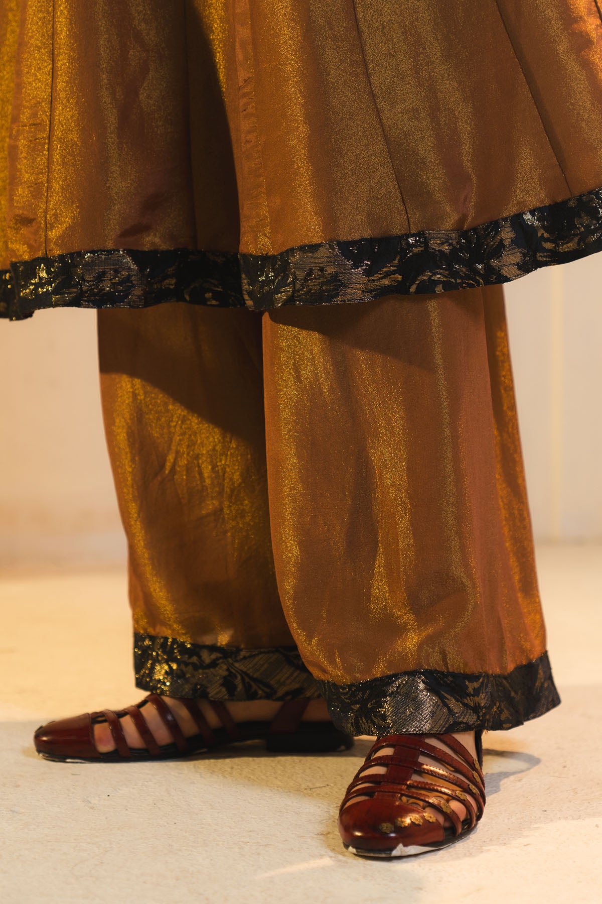Anarkali Kurta In Gold, Paired With Flared Trousers.