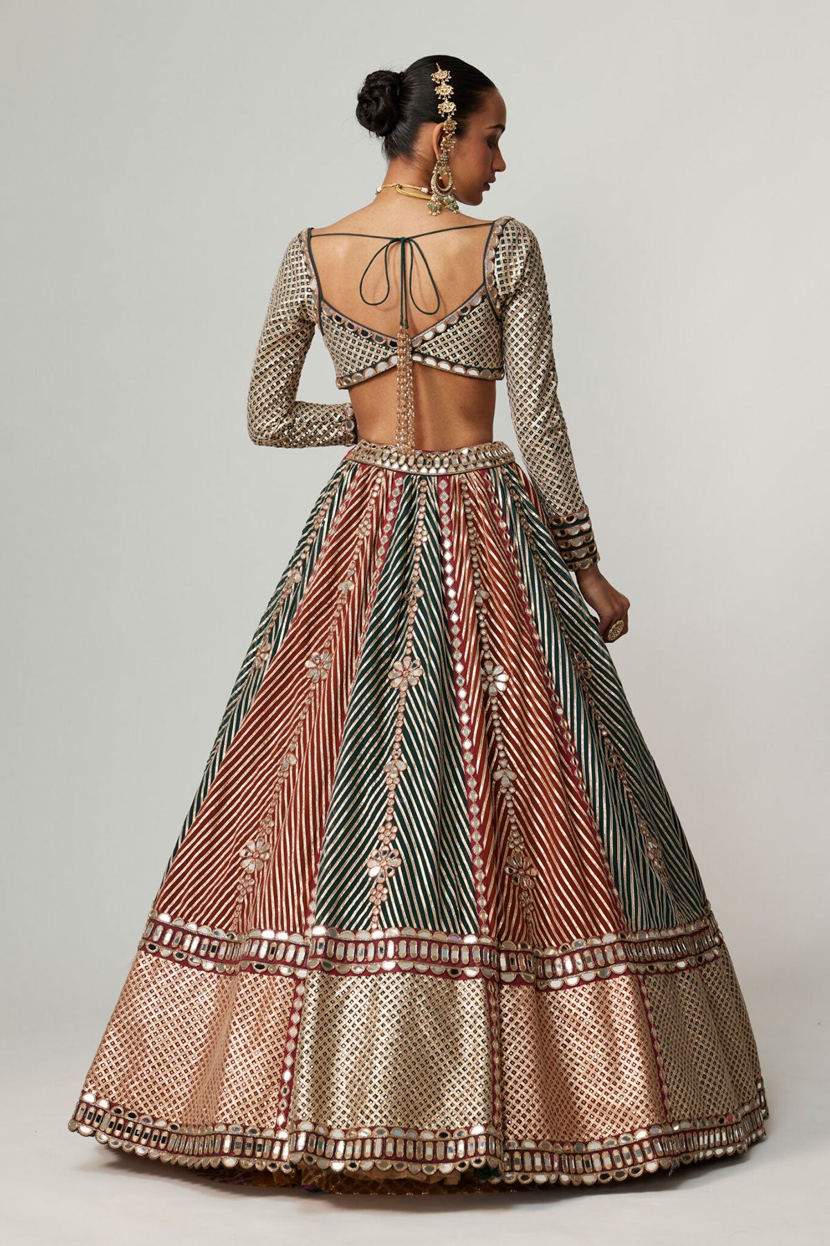 CRANBERRY FLOWER LINEAR LEEHNGA WITH FULL SLEEVE BLOUSE.