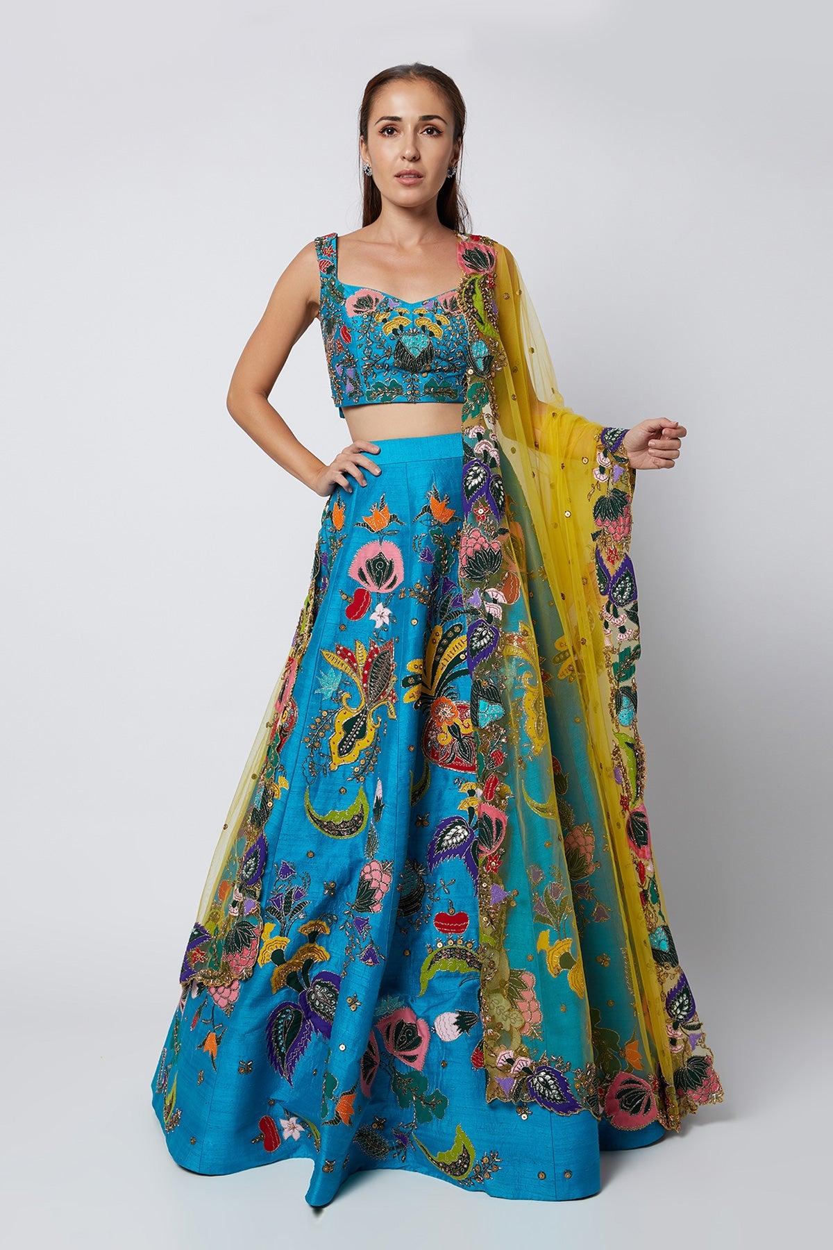 KAIRA - Cyan Blue Nadenka Raw Silk Appliquéd And Embellished Lehenga With Blouse And Cutwork Tulle Dupatta